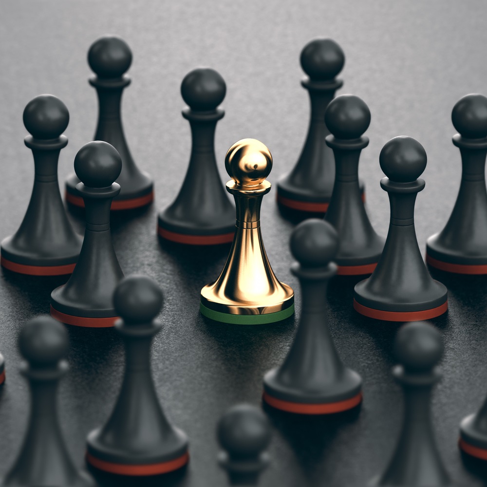 Michael Van Eaton related image featuring chess pieces placed across a dark playing surface