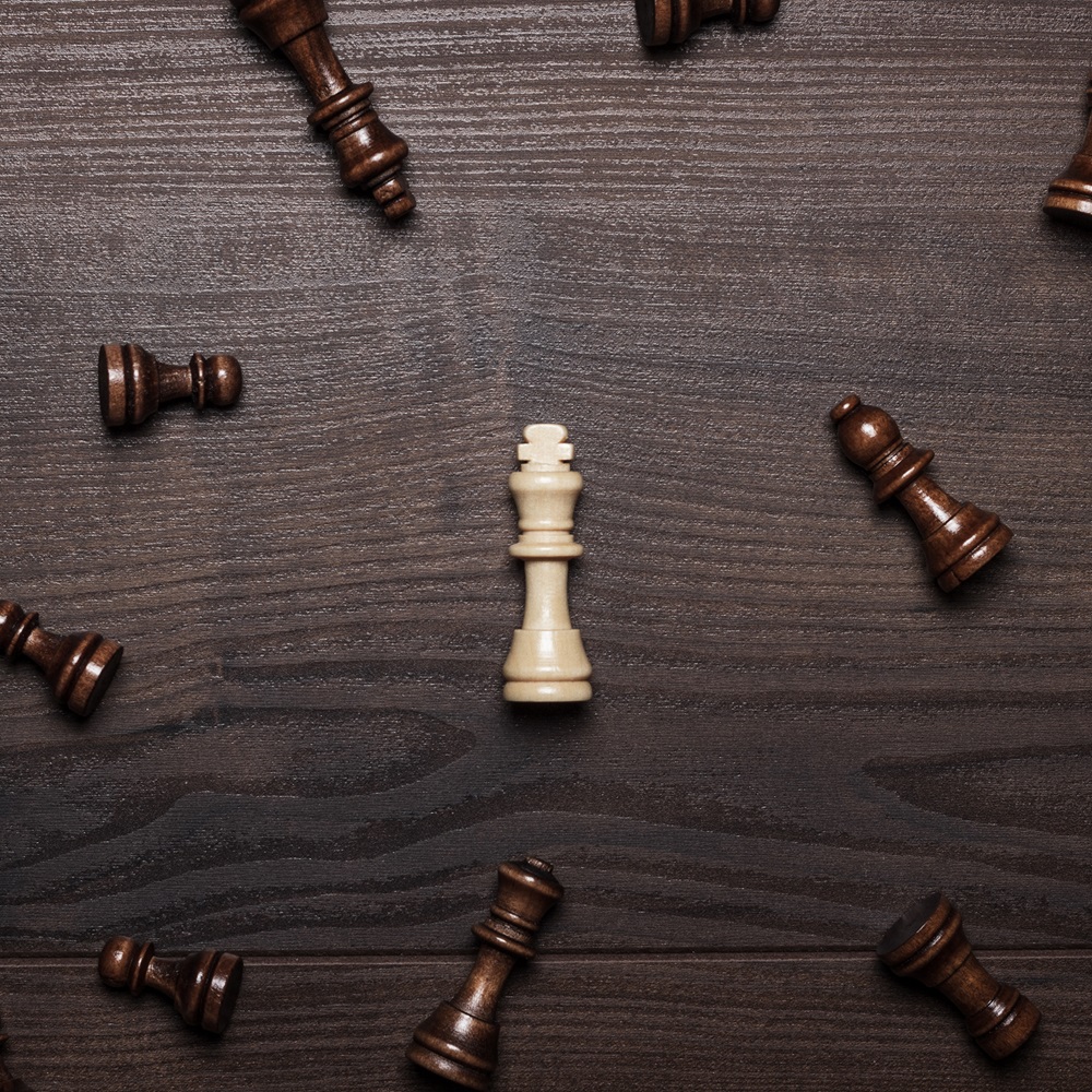 Michael Van Eaton related image showing wooden chess pieces arranged in different positions
